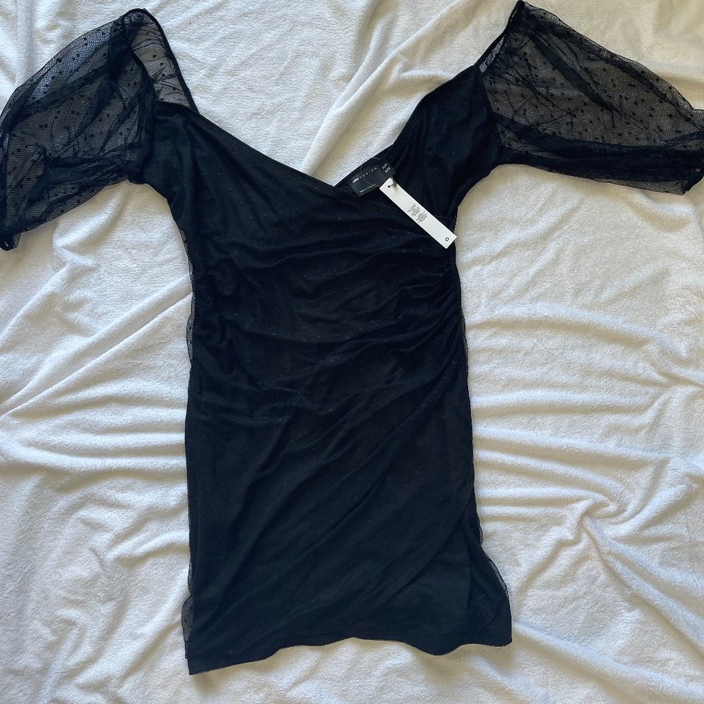 Striking and Sophisticated: Stand Out in Style with this Sheer Black Mesh Dress